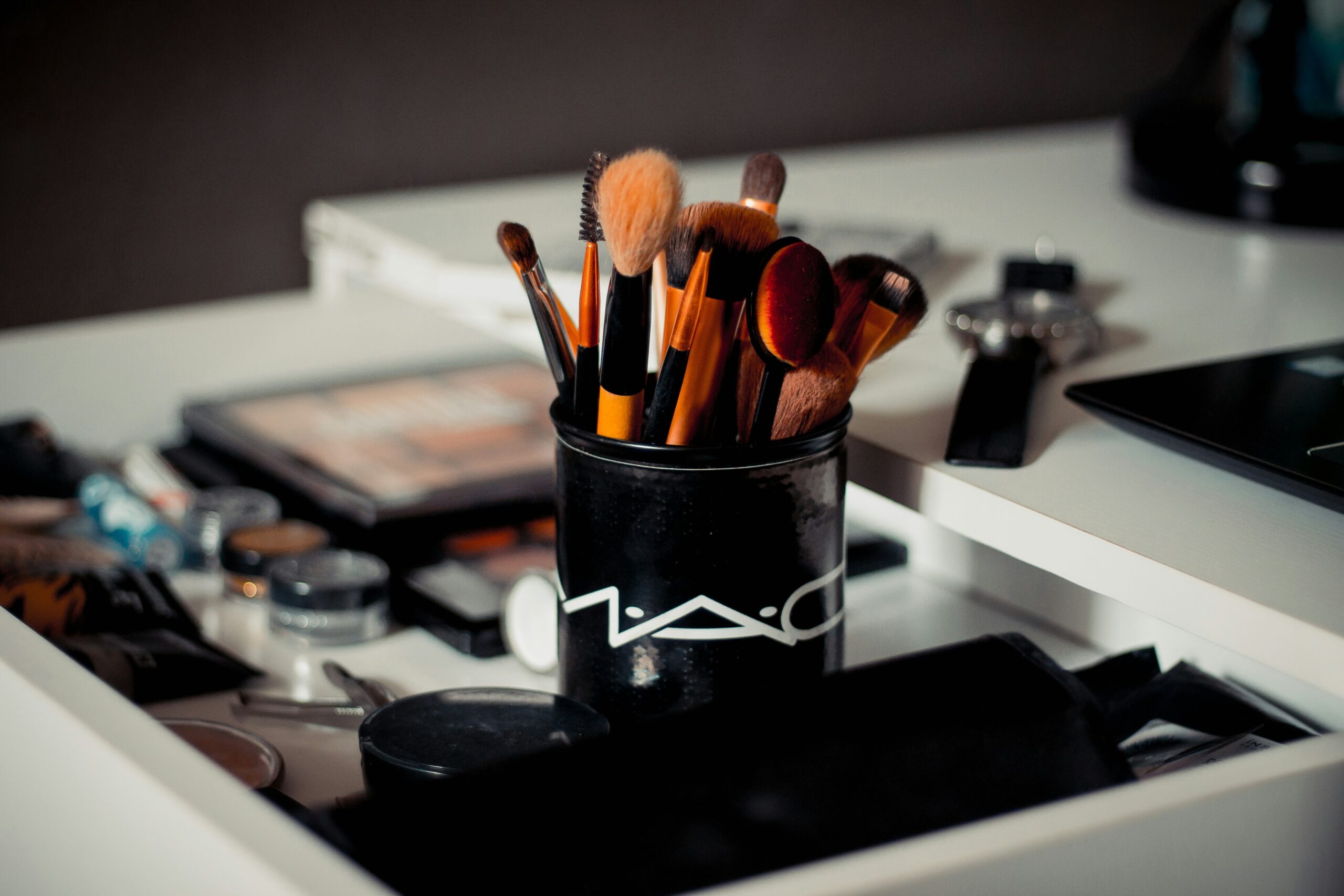 Close-up photo of model with bold red lips and dramatic eyeshadow created following editorial standards.