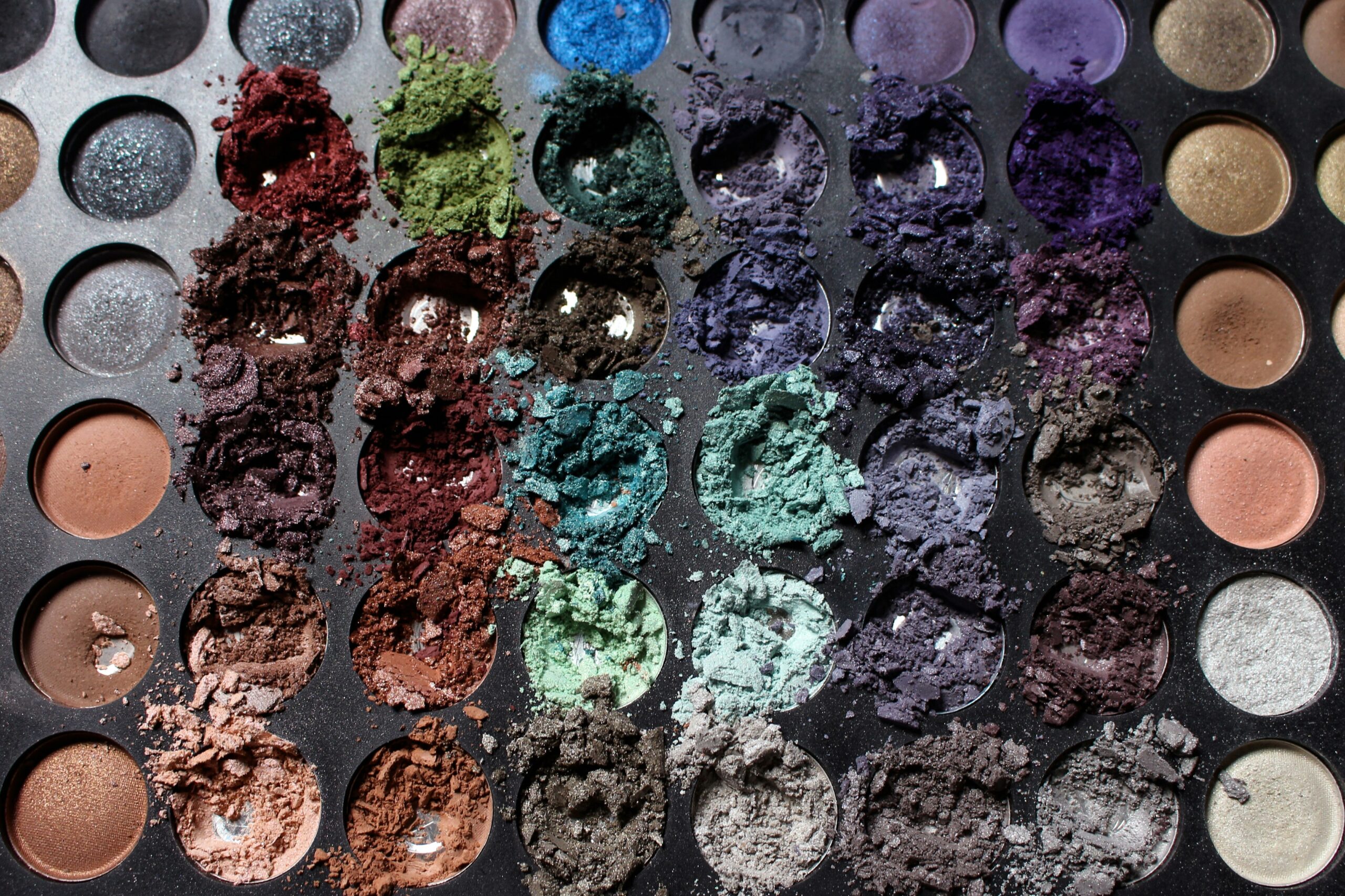Colorful makeup palettes arranged neatly for avant-garde inspiration