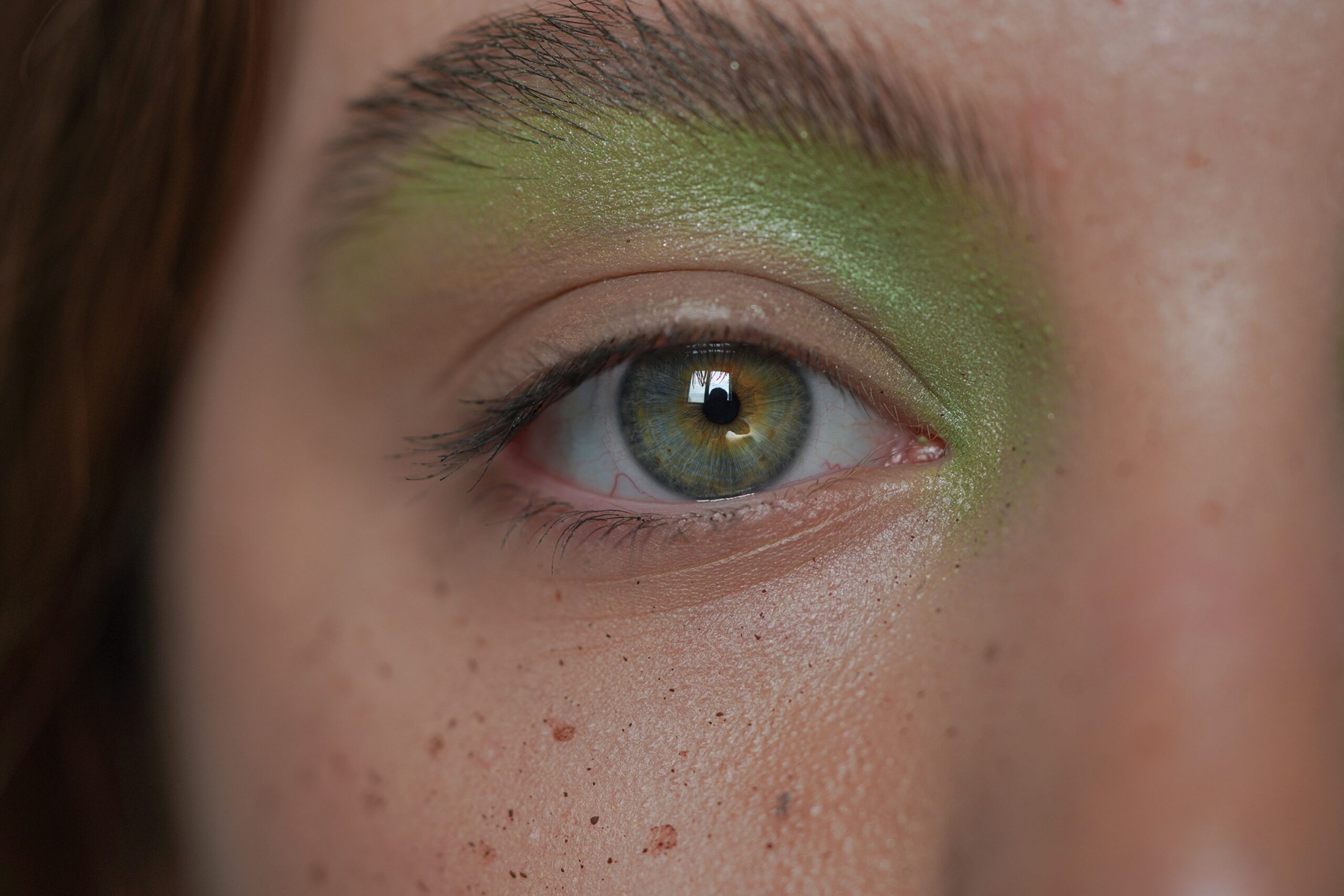 Final result of a completed editorial makeup look with vibrant colors and unique textures