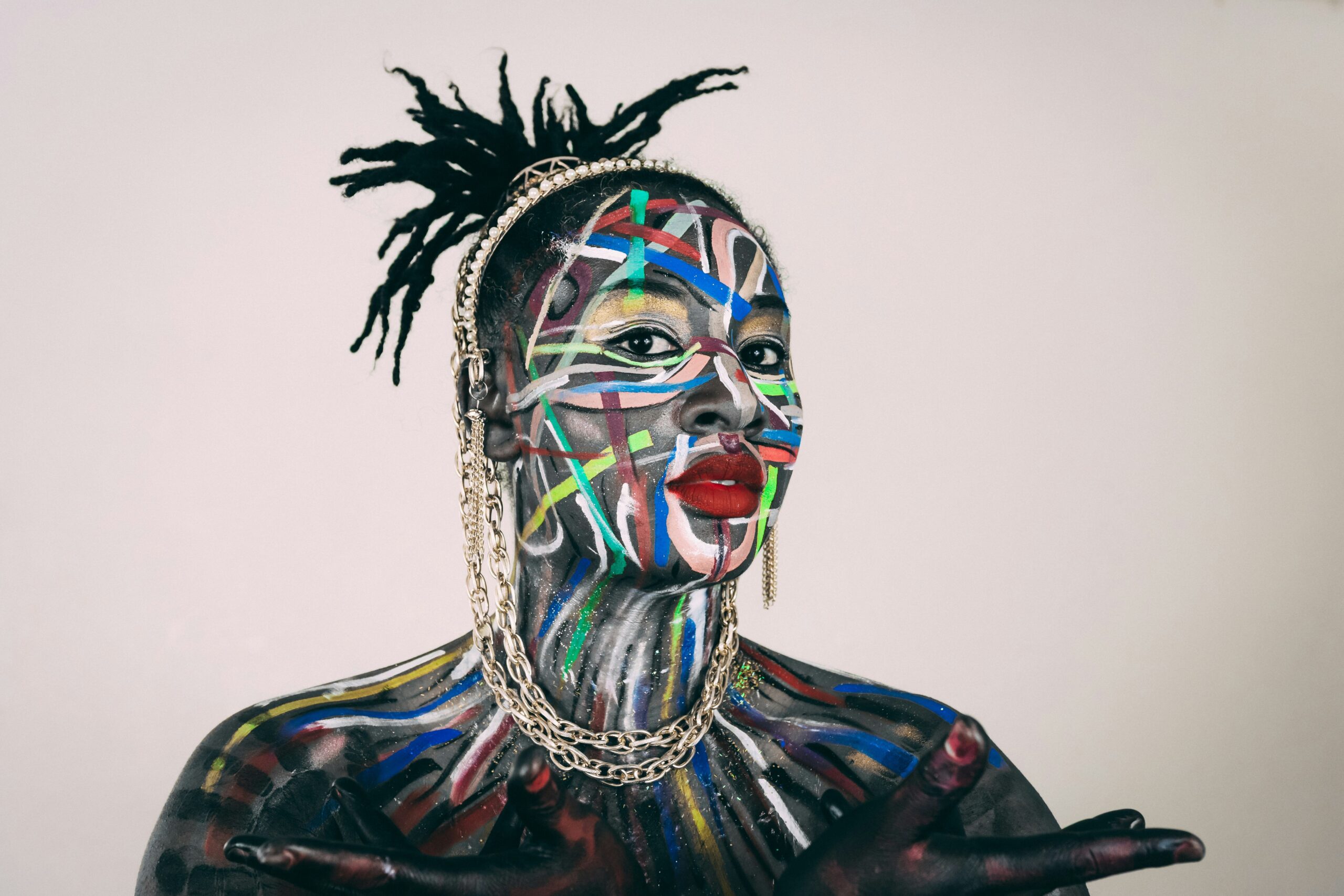A model showcasing bold blush applied asymmetrically on her face as part of an editorial photoshoot