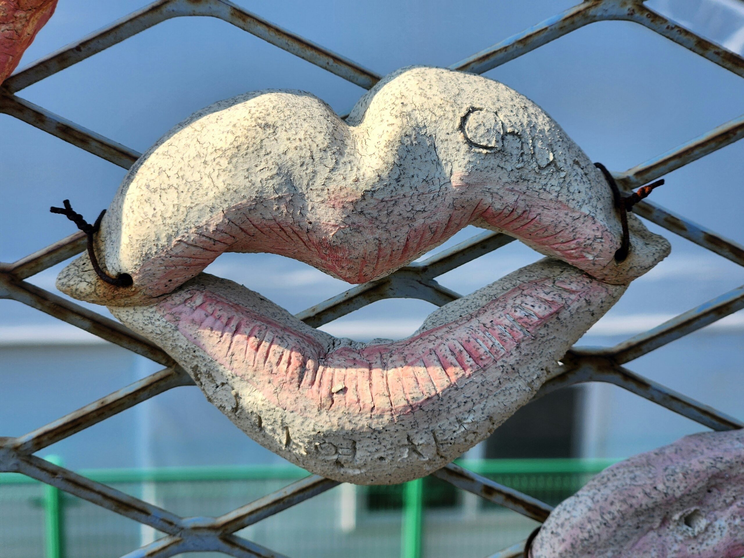 A model showcasing vibrant geometric lip art design