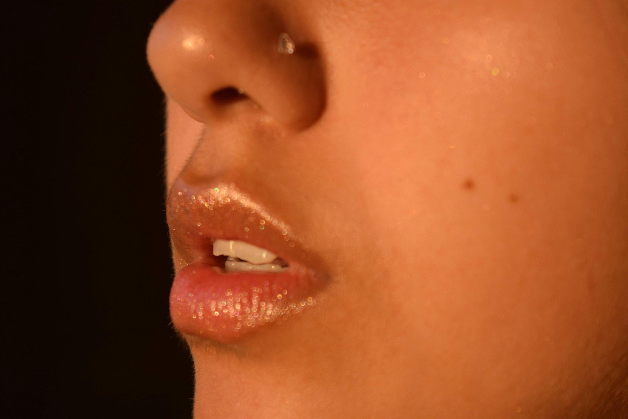 A close-up image showing different sophisticated lip shades on diverse skin tones