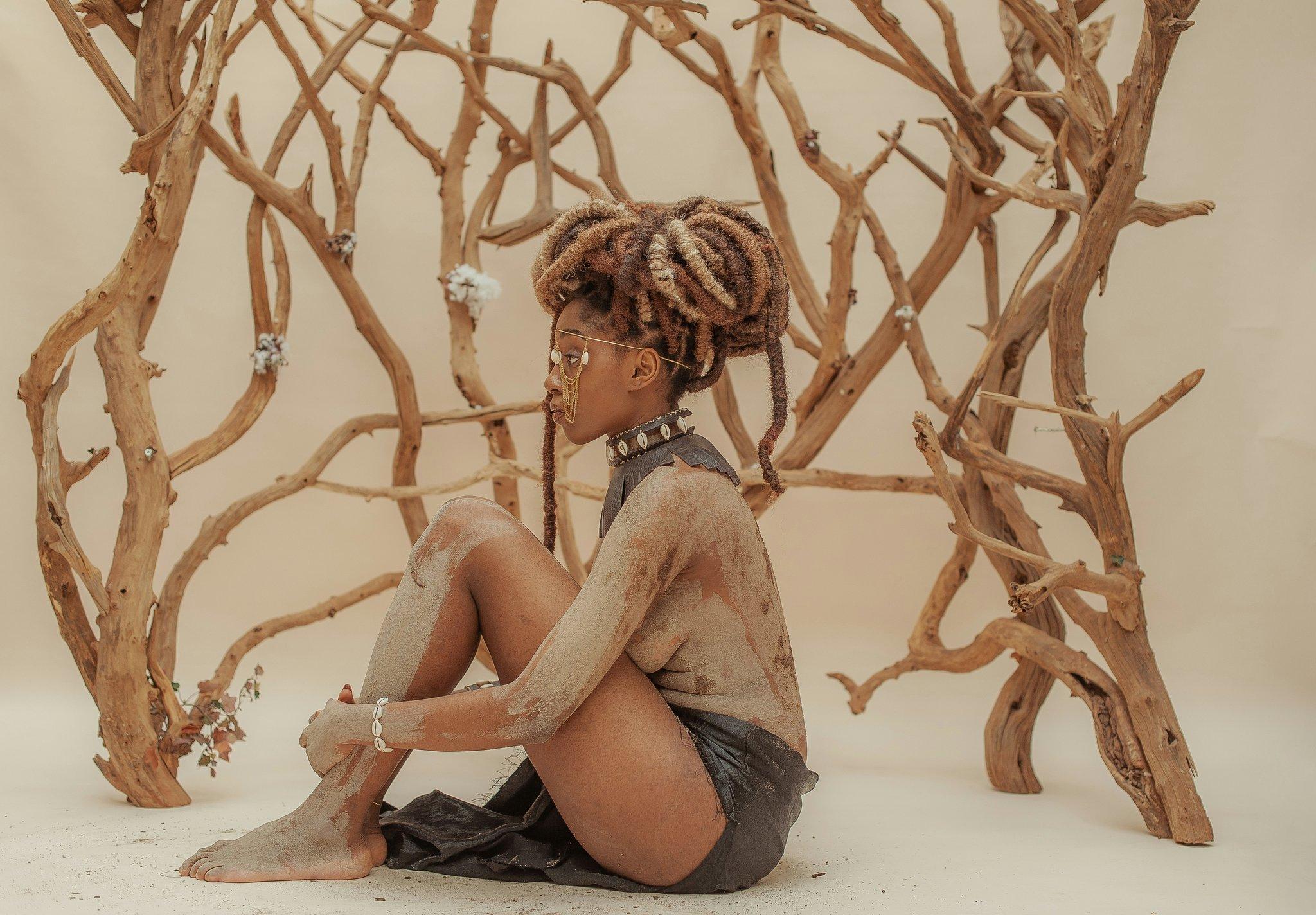 Close-up of model wearing interstellar-themed galaxy makeup with shimmering purples and blues