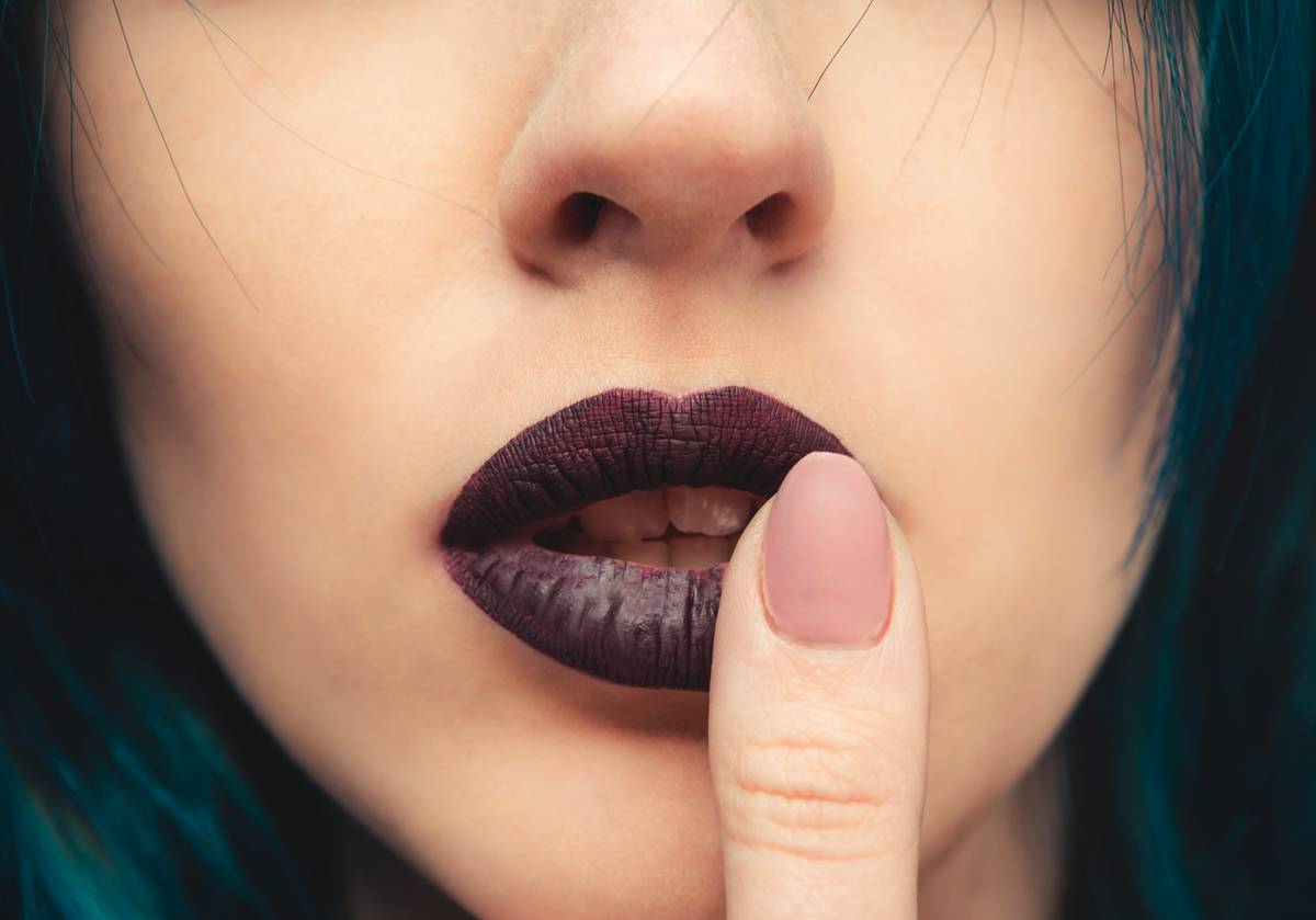 Close-up photo of model wearing geometric-patterned lips