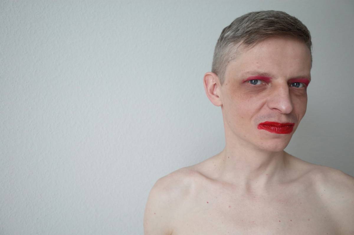 Close-up shot of model wearing futuristic avant-garde makeup with glowing LED elements