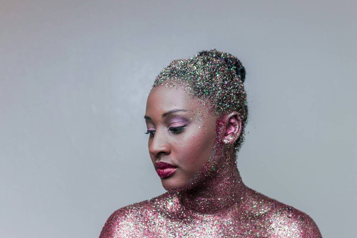 Close-up of textured eye makeup featuring metallic foil accents