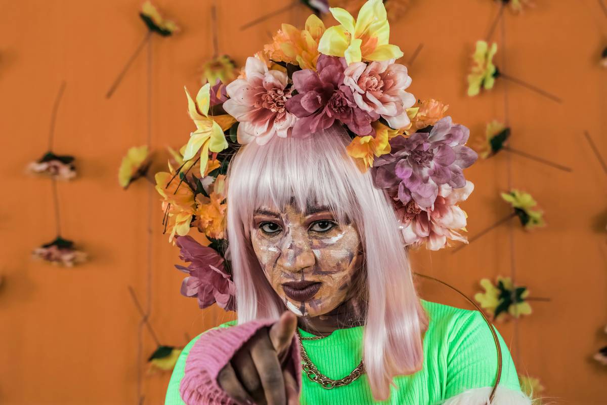 Collage of famous editorial makeup styles showcased during fashion weeks around the world.