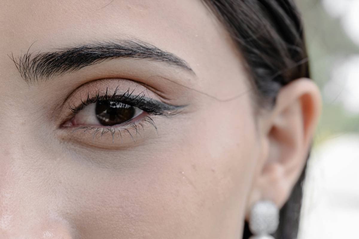 Detailed process shot showing avant-garde brow creation steps